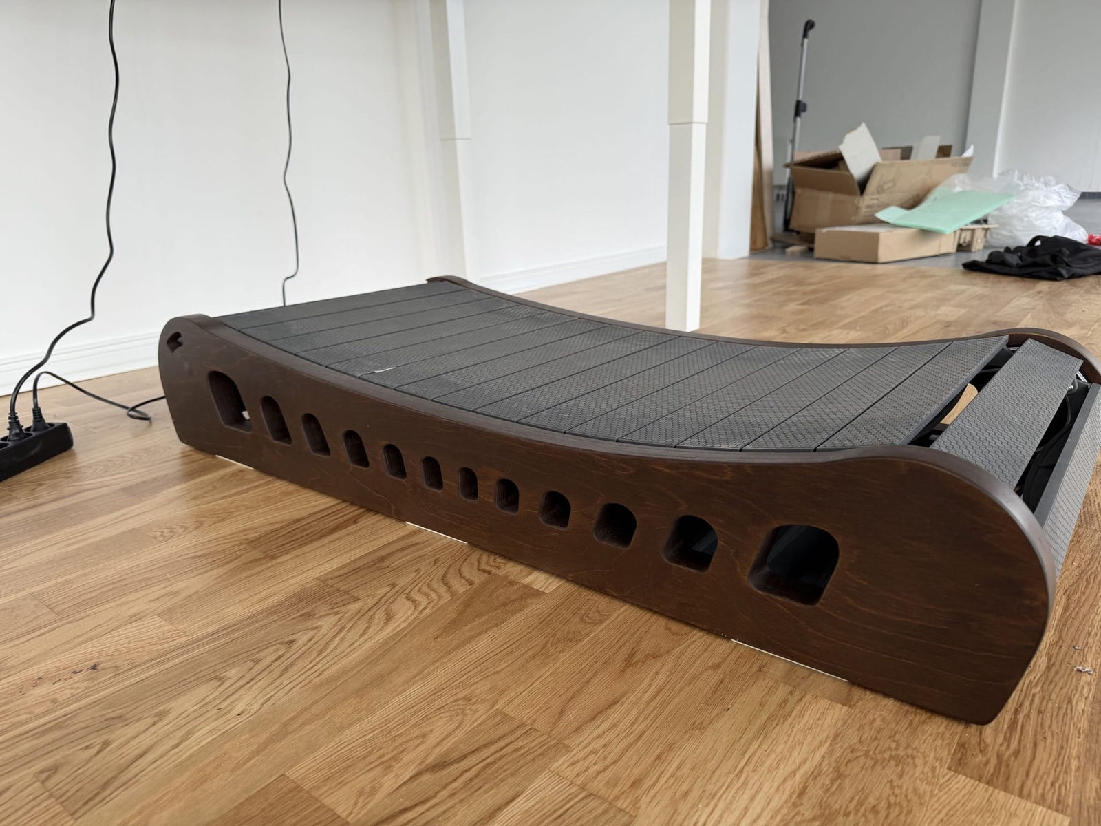 The Office Walker under a standing desk in a home living room